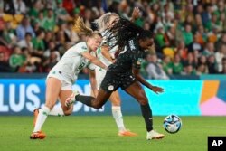 Ireland's Ruesha Littlejohn, left, battle for the ball with Nigeria's Antionette Payne during the Women's World Cup Group B soccer match between Ireland and Nigeria in Brisbane, Australia, July 31, 2023.