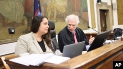 Judge Arthur Engoron talks with his principal law clerk Allison Greenfield during the fraud trial for former President Donald Trump at New York Supreme Court, Nov. 2, 2023, in New York.