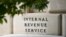 FILE - A sign outside the Internal Revenue Service building is seen, May 4, 2021, in Washington. 