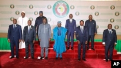 Nigeria's President, Bola Ahmed Tinubu, third from left, first row, poses for a group photo with other West African leaders, prior to the start of the ECOWAS meeting, in Abuja, Nigeria on Saturday, February 24, 2024.