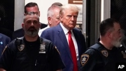 Former President Donald Trump arrives for his arraignment at Manhattan Federal Court in New York, April 4, 2023. 