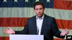 FILE - Florida Governor Ron DeSantis speaks in Davenport, Iowa, March 10, 2023. After being criticized for remarks that seemed to advocate reducing U.S. support for Ukrainian forces, DeSantis called Russian President Vladimir Putin a “war criminal” this week.