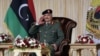 FILE- Libyan military commander Khalifa Haftar gestures during Independence Day celebrations in Benghazi, Libya December 24, 2020. 