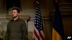 Ukrainian President Volodymyr Zelenskyy waits to speak at the National Archives building in Washington, Sept. 21, 2023, during his U.S. visit.