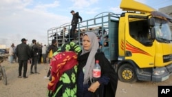 Palestinians fleeing the Israeli offensive on Khan Younis arrive at Rafah, Gaza Strip, Feb. 14, 2024.