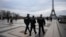 French gendarmes patrol the Trocadero plaza near the Eiffel Tower after a man targeted passersbys late Saturday, killing a German tourist with a knife and injuring two others in Paris, Dec. 3, 2023.