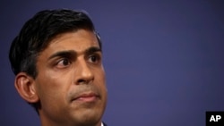 FILE - Britain's Prime Minister Rishi Sunak looks on during a news conference at Number 9 Downing Street on public sector pay, in London, July 13, 2023.