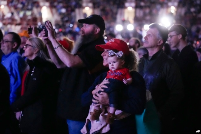 Supporters listen as Republican presidential candidate and former President Donald Trump speaks at the National Rifle Association's Presidential Forum in Harrisburg, Pennsylvania, Feb. 9, 2024.