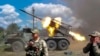 Russian soldiers fire from the BM-21 "Grad" self-propelled 122mm multiple rocket launcher in an undisclosed location in Ukraine, July 1, 2024.