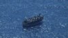 A boat in distress with about 400 people on board is pictured in the Mediterranean Sea in this handout obtained by Reuters on April 10, 2023. (Giacomo Zorzi/Sea-Watch/Handout via Reuters)