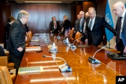 Sergey Lavrov, Russia's Minister for Foreign Affairs, current president of the Security Council, second from right, and Antonio Guterres, U.N. Secretary General, left, prepare to start their meeting at the secretariat offices, April 24, 2023, at United Nations headquarters.