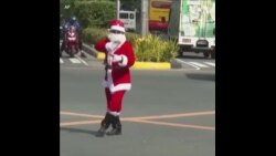 菲律宾交警装扮成圣诞老人跳舞指挥交通 