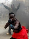 A man gestures during a demonstration over police killings of people protesting against the imposition of tax hikes by the government, in Nairobi, Kenya.