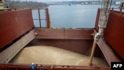 FILE - U.N.-chartered vessel MV Valsamitis is loaded to deliver Ukrainian wheat to Kenya and Ethiopia, at the port of Chornomorsk on Ukraine's Black Sea coast, Feb. 18, 2023.