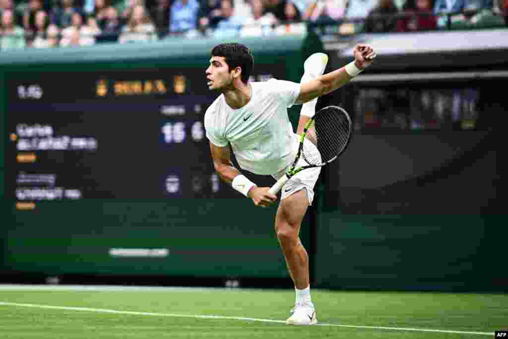 Spain&#39;s Carlos Alcaraz serves the ball to France&#39;s Jeremy Chardy &nbsp;during their men&#39;s singles tennis match on the second day of the 2023 Wimbledon Championships at The All England Tennis Club in Wimbledon, London.