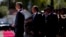 Cyprus' President Nikos Christodoulides, second left, and Greek Prime Minister Kyriakos Mitsotakis, left, review a military guard of honor before their meeting at the Presidential Palace in Nicosia, Cyprus, July 31, 2023.