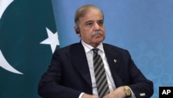 FILE - Pakistani Prime Minister Shehbaz Sharif attends a meeting in Astana, Kazakhstan, July 3, 2024. Sharif's government has supported Pakistan's move to allow the Inter-Services Intelligence, or ISI, to monitor citizens' phone calls.