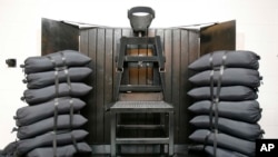 FILE - A chair sits in the execution chamber at the Utah State Prison on June 18, 2010, after Ronnie Lee Gardner was executed by firing squad in Draper, Utah. 
