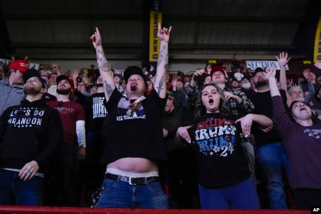 Supporters cheer as Republican presidential candidate and former President Donald Trump speaks at the National Rifle Association's Presidential Forum in Harrisburg, Pennsylvania, Feb. 9, 2024.