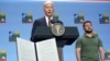 FILE - U.S. President Joe Biden speaks at an event, with G7 leaders and Ukraine’s President Volodymyr Zelenskyy, at right, in Vilnius, Lithuania, July 12, 2023. Biden wants G7 members to provide up to $50 billion in loans for Ukraine by using interest from frozen Russian assets.