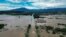 FILE - An aerial view shows flooded streets in the Amapa community, Duque de Caxias, Rio de Janeiro state, Brazil, Jan. 15, 2024. Heavy rain has continued to dog the state, with eight deaths recorded Feb. 22, 2024, because of landslides and floods.