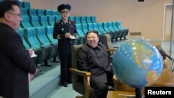 North Korea's leader Kim Jong-un visits the National Aerospace Technology Administration to inspect readiness of the reconnaissance satellites and view aerospace photographs in this picture released by the Korean Central News Agency on Nov. 25, 2023.