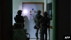 This handout picture released by the Israeli army on Nov. 15, 2023, reportedly shows Israeli soldiers carrying out operations inside Al-Shifa hospital in Gaza City.