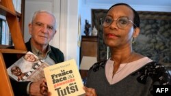 FILE - Alain (L) and Dafroza Gauthier, Rwandan genocide-hunters and founders of Collective of Civil Parties for Rwanda pose in their home with books, five days before the commemorations for its 30th anniversary in Reims on March 26, 2024.