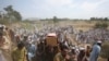 FILE - People carry the coffins of those who were killed in a blast, during a funeral in the Bajaur district of Khyber Pakhtunkhwa province, Pakistan, July 31, 2023.