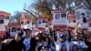 FILE - Jewish Americans and supporters of Israel hold signs as they gather in solidarity with Israel and protest against antisemitism during a rally on the National Mall in Washington, Nov. 14, 2023.