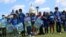 FILE - Demonstrators lock arms during a rally with migrant families and immigration advocates calling for a pathway towards citizenship, on Capitol Hill in Washington, Sept. 20, 2021. 