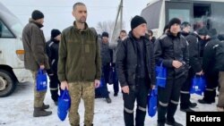 FILE - Ukrainian prisoners of war are seen after a swap, amid Russia's attack on Ukraine, in an unknown location, Ukraine, in this handout picture released Feb. 4, 2023.