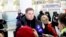 A Russian tourist speaks to the media as a group of Russian tourists, likely the first foreign travelers from any country to enter North Korea since the pandemic arrive at the Pyongyang International Airport in Pyongyang, North Korea,  Feb. 9, 2024. 