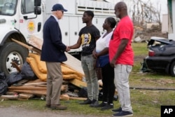 President Joe Biden speaks with those impacted by last week's deadly tornado and severe storm in Rolling Fork, Mississippi, March 31, 2023.