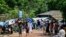 Rohingya refugees gather to buy essentials at a market area in Kutupalong camp a day after cyclone Mocha made landfall, in Ukhia, Bangladesh, May 15, 2023.