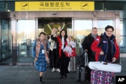A group of Russian tourists, likely the first foreign travelers from any country to enter North Korea since the pandemic arrive at the Pyongyang International Airport in Pyongyang, North Korea, Feb. 9, 2024.