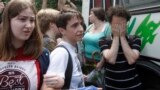 FILE - Russia-born US journalist Masha Gessen, center, takes part in a protest against a proposed new law termed by the State Duma as 'against advocating the rejection of traditional family values' in central Moscow, June 11, 2013. 