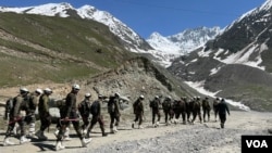 Soldiers walk to their camp sites in Ladakh, June 21, 2023. (Bilal Hussain/VOA)