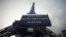 A sign accouncing the closing of the Eiffel Tower due to a strike is seen in front of the 19th century landmark in Paris, France, Feb. 19, 2024.