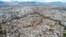 FILE - This picture taken on December 8, 2023 shows an aerial view of the divided walled city of Cyprus' capital Nicosia and the city center in the area controlled by the Republic of Cyprus in the foreground.