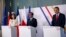 From left, German Foreign Minister Annalena Baerbock, French Foreign Minister Stephane Sejourne and Polish Foreign Minister Radoslaw Sikorski speak to reporters at the Chateau de La Celle Saint-Cloud near Paris, Feb. 12, 2024.