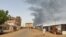 Smoke billows in southern Khartoum on June 12, 2023, as deadly shelling and gunfire resumed after the end of a 24-hour cease-fire in Sudan. 