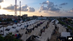 FILE - A UNDP-provided tent camp for Palestinians displaced by the Israeli bombardment of the Gaza Strip is seen in Khan Younis, Oct. 19, 2023. 