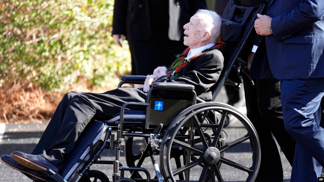 FILE — Former U.S. President Jimmy Carter departs after the funeral or his wife, former first lady Rosalynn Carter, at Maranatha Baptist Church in Plains, Georgia, Nov. 29, 2023. In the year since Carter entered home hospice, the 39th president has celebrated his 99th birthday.