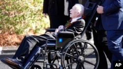 FILE — Former U.S. President Jimmy Carter departs after the funeral or his wife, former first lady Rosalynn Carter, at Maranatha Baptist Church in Plains, Georgia, Nov. 29, 2023. In the year since Carter entered home hospice, the 39th president has celebrated his 99th birthday.