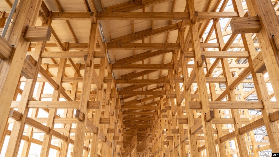 This April 2, 2024, photo shows construction of the 'Grand Roof,' one of the world's largest wooden structures, at the site of the 2025 Expo on Yumeshima island, an area of reclaimed land in Osaka, Japan. 