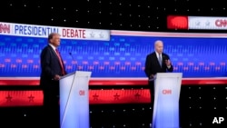 President Joe Biden, right, and Republican presidential candidate former President Donald Trump, left, during a presidential debate hosted by CNN, June 27, 2024, in Atlanta.