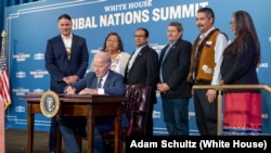 President Joe Biden signs the Executive Order on Reforming Federal Support for Tribal Nations, Wednesday, December 6, 2023, at the White House Tribal Nations Summit at the U.S. Department of the Interior in Washington, D.C.