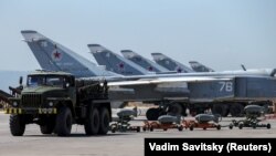 (FILE) Russian military jets are seen at Hmeymim air base in Syria.