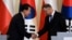 South Korea's President Yoon Suk Yeol shakes hands with Polish President Andrzej Duda, as they attend a joint press conference at the Presidential Palace in Warsaw, Poland, July 13, 2023.